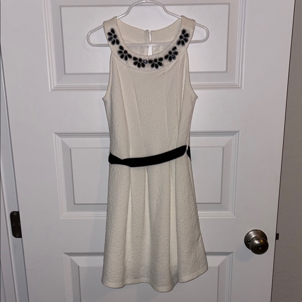 Elegant White Dress with Black Floral Accents
